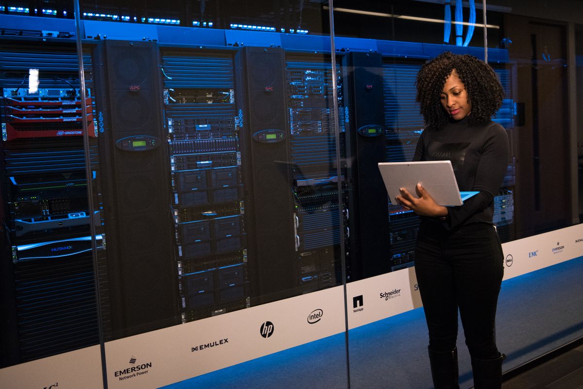 Black engineer working with infrastructure in a modern data center